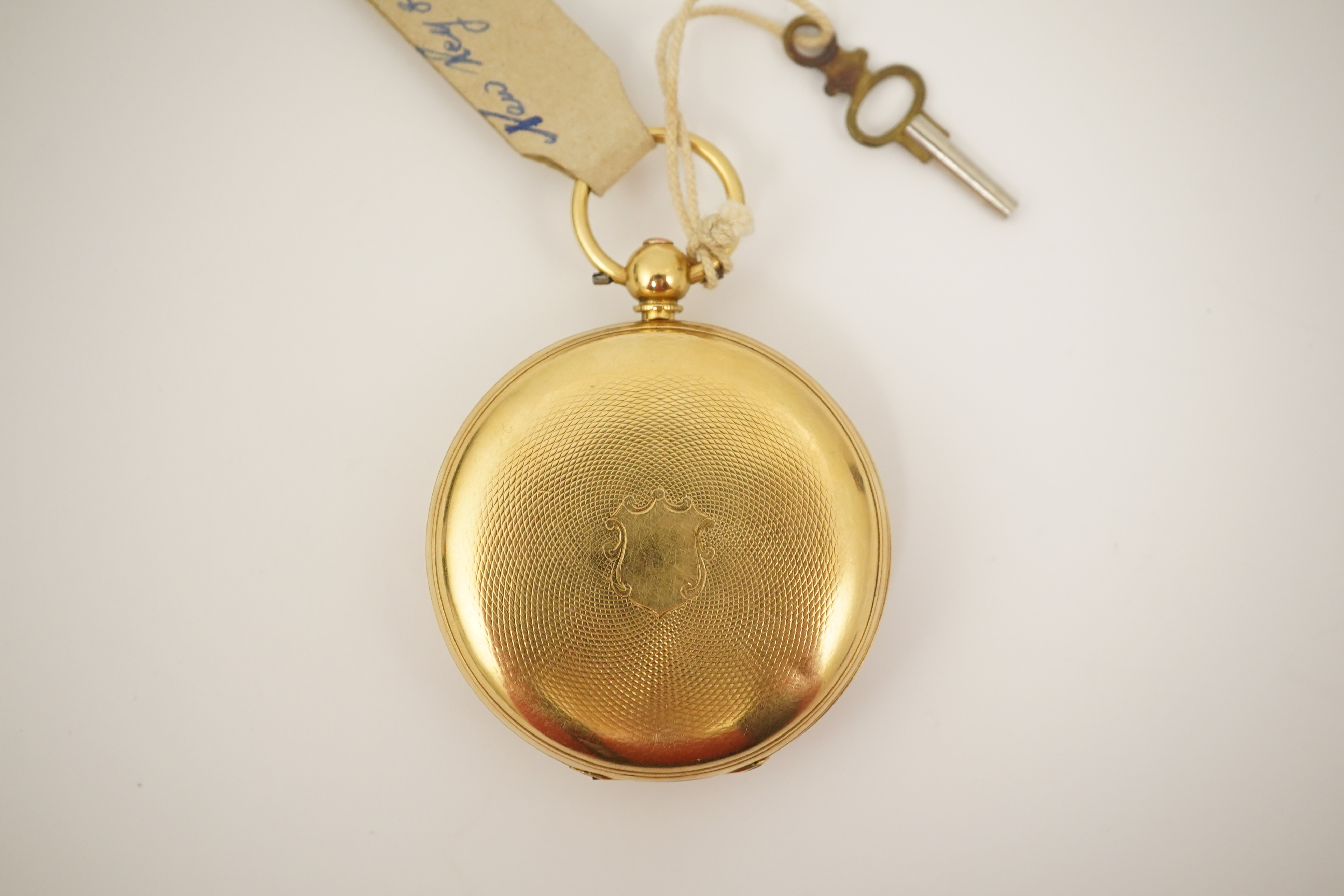 A Victorian engine turned 18ct gold open faced key wind pocket watch